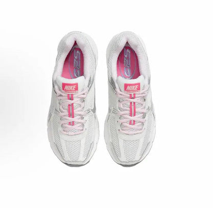 Running shoe, white with pink laces and pink interior lining, top view