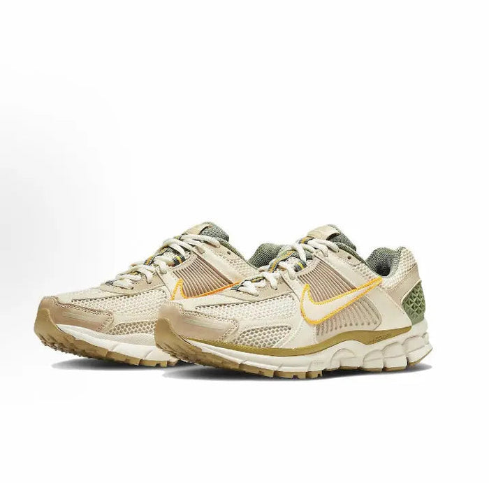 Nike Zoom Vomero 5 SP low-top sneakers, pale ivory with orange swoosh and green heel