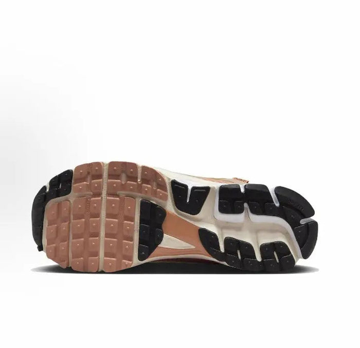 Nike Zoom Vomero 5 SP outsole view with brown and black traction pods