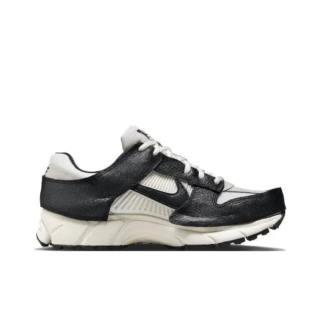 Nike Zoom Vomero 5 SP running shoe, black upper with light bone trim and lace-up