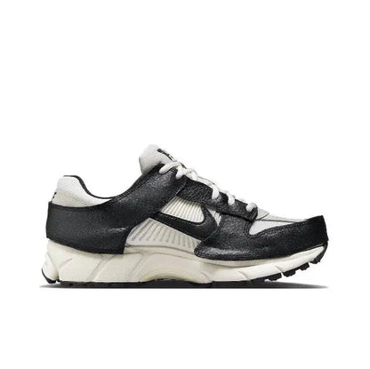 Nike Zoom Vomero 5 SP running shoe, black upper with light bone trim and lace-up
