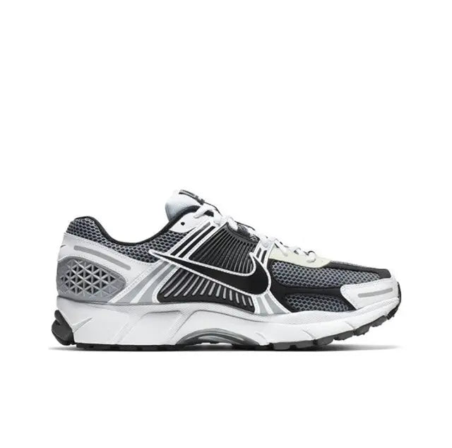 Black, white and dark grey running sneaker, side view with mesh panels