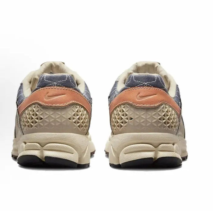 Nike Zoom Vomero 5 SP sneaker heel with orange logo patch and ridged foam sole