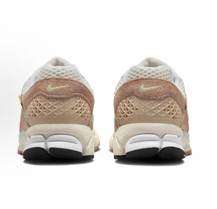 Nike Zoom Vomero 5 SP heel view in tan and pale aqua with cushioned sole