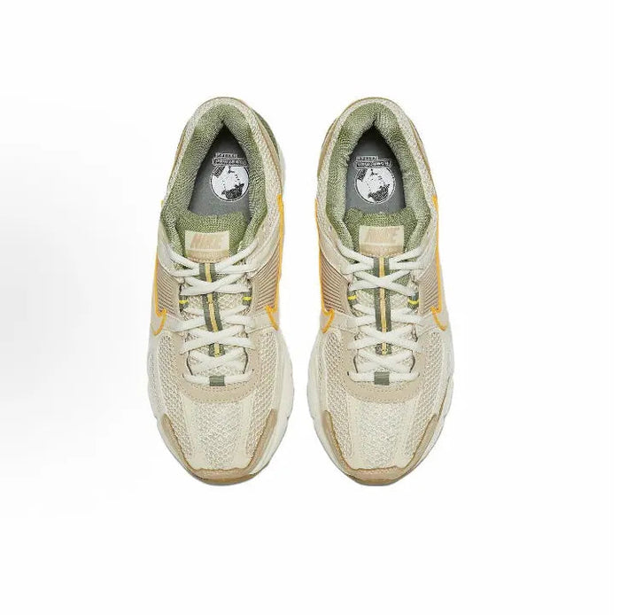 Nike Zoom Vomero 5 SP lace-up sneakers, pale ivory uppers with green insoles visible