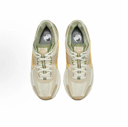 Nike Zoom Vomero 5 SP lace-up sneakers, pale ivory uppers with green insoles visible