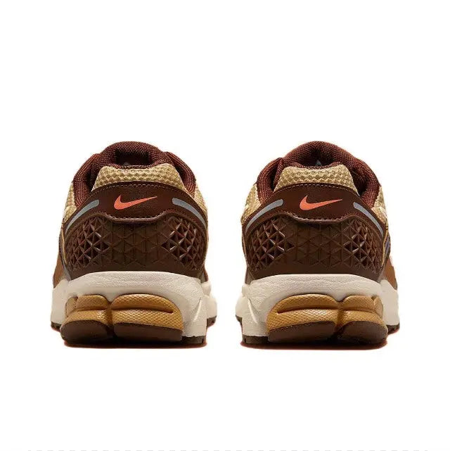 Running sneakers heel view with brown textured panels, white midsole, and orange logo