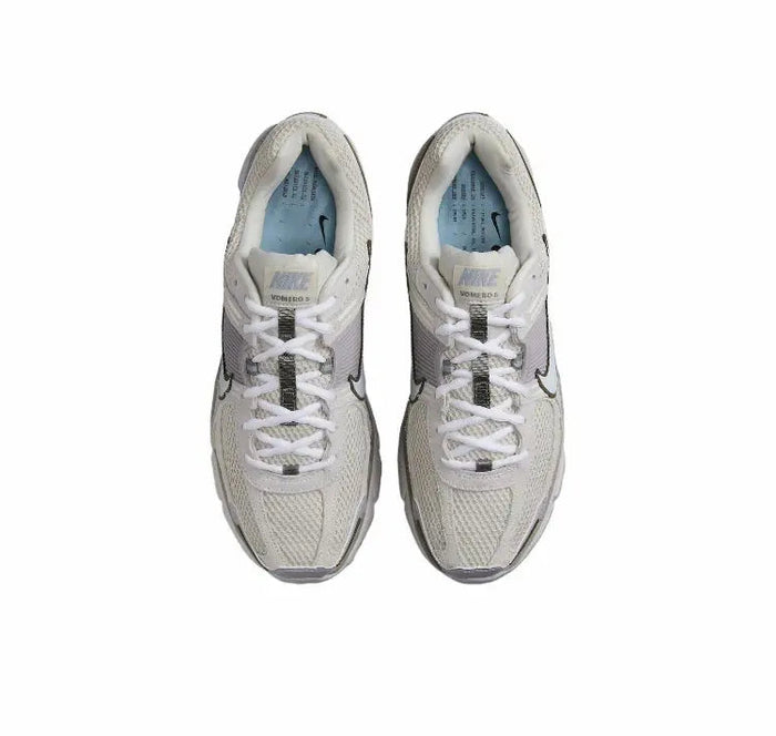 Nike Zoom Vomero 5 SP running shoe top view, light beige upper with white laces