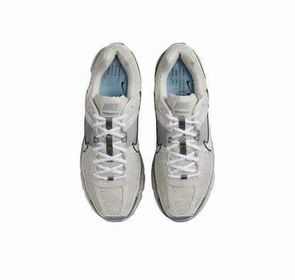 Nike Zoom Vomero 5 SP running shoe top view, light beige upper with white laces