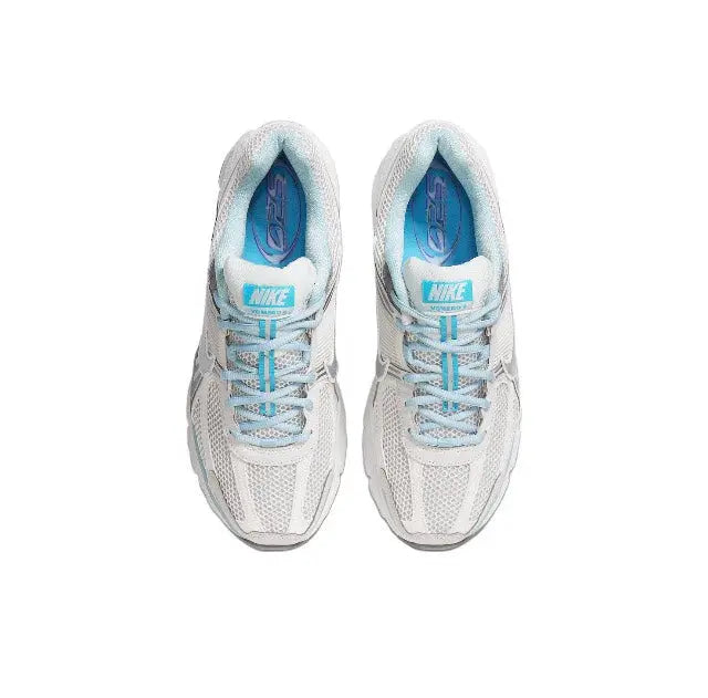 Running sneaker top view, light grey mesh with light-blue laces and lining