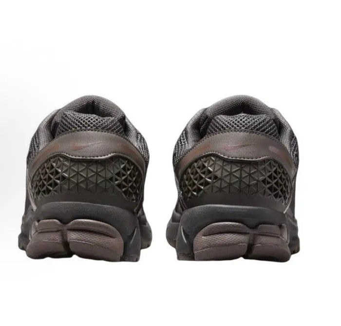 Running shoe heel view in dark gray mesh with textured rubber outsole