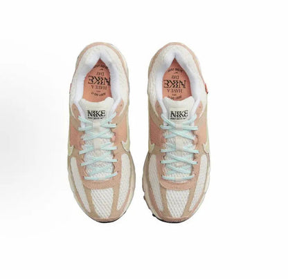 Nike Zoom Vomero 5 SP shoe pair showing laces and light interior lining