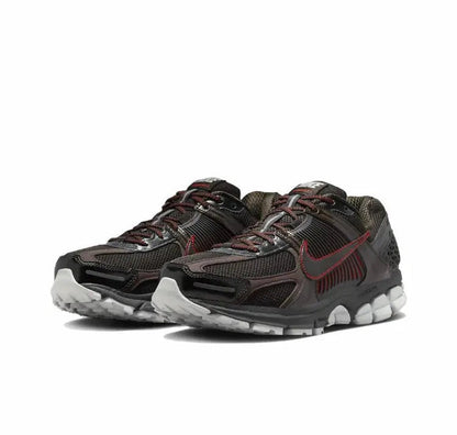 Running shoes with dark mesh uppers, red swoosh, and chunky cushioned sole