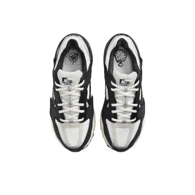 Nike Zoom Vomero 5 SP running shoe pair with white laces and black-and-white uppers