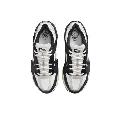 Nike Zoom Vomero 5 SP running shoe pair with white laces and black-and-white uppers