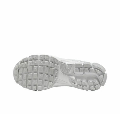 Running shoes outsole view with tread pattern and white/gray rubber base