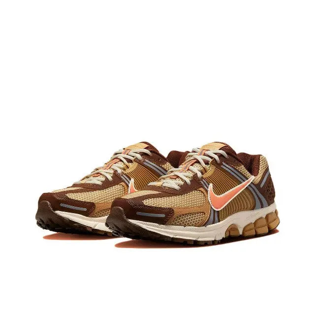 Running sneakers front view, brown mesh with orange swoosh, white midsole, laces