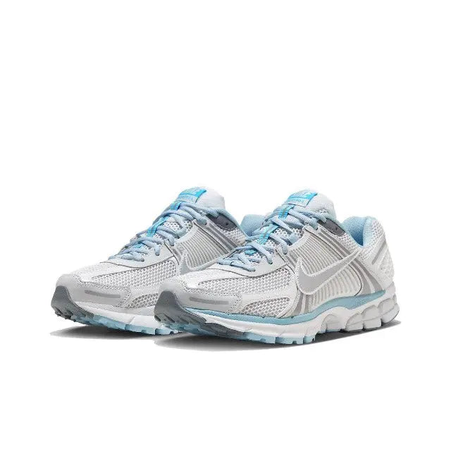 Pair of light grey running sneakers with light-blue laces and side logo