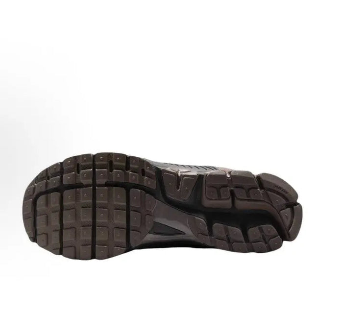 Running shoe outsole view with grid tread and dark rubber