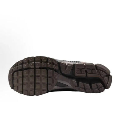 Running shoe outsole view with grid tread and dark rubber