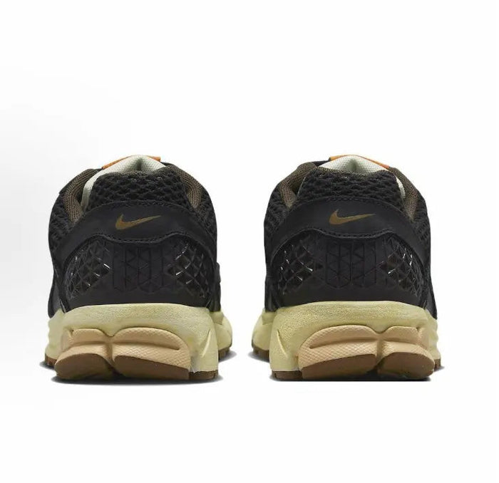 Nike running shoes heel view, black mesh with tan cushioning midsole