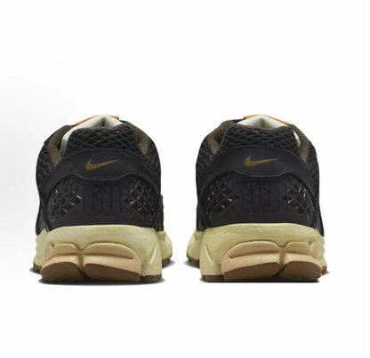 Nike running shoes heel view, black mesh with tan cushioning midsole
