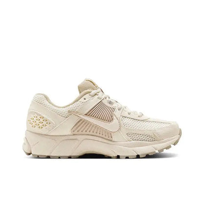 Pale ivory running sneaker with geometric side panel and lace-up vamp