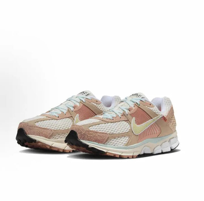 Nike Zoom Vomero 5 SP sneaker side view in tan and pink with lime swoosh