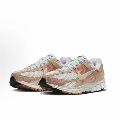 Nike Zoom Vomero 5 SP sneaker side view in tan and pink with lime swoosh