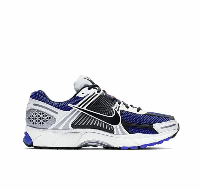 Zoom Vomero 5 SP running shoe side view in white with blue mesh panels and black laces