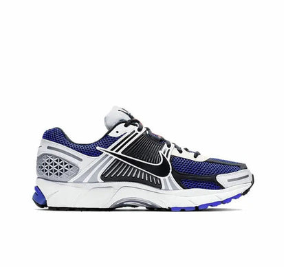 Zoom Vomero 5 SP running shoe side view in white with blue mesh panels and black laces
