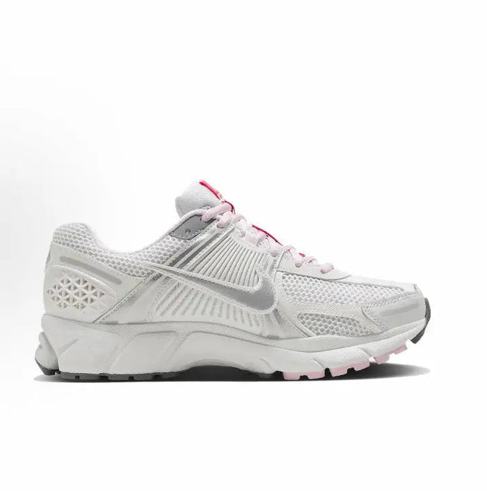 Running shoe, white with pink laces, lateral side view